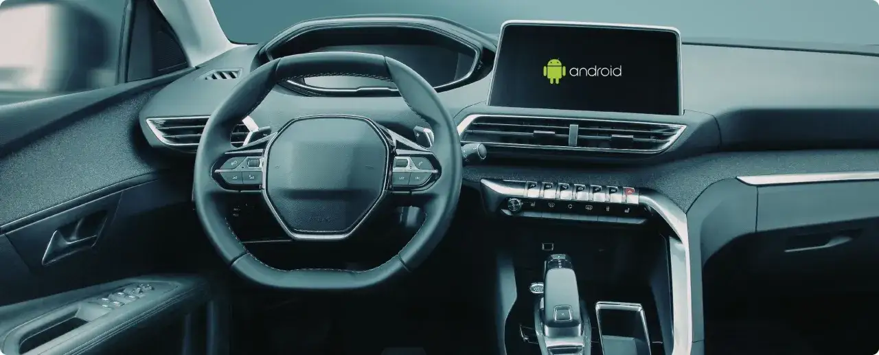 Wnętrze samochodu z ekranem Android Auto. Dowiedz się, jak dodać aplikacje do Android Auto, aby podróżować wygodniej.